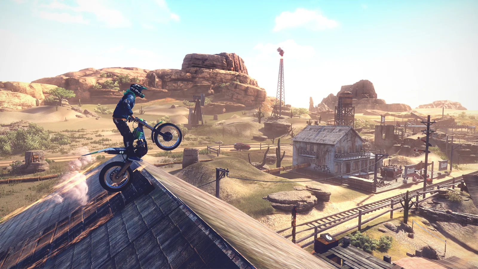 Un piloto de Trials Rising salta con su moto sobre un tejado